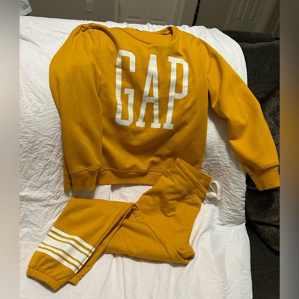 A gap yellow mustard jumpsuit. A sweatshirt and pants, white striped bottoms.